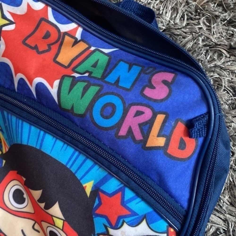 Kids Ryan’s World backpack small spot on front might be washable minimal usage. - Picture 3 of 5
